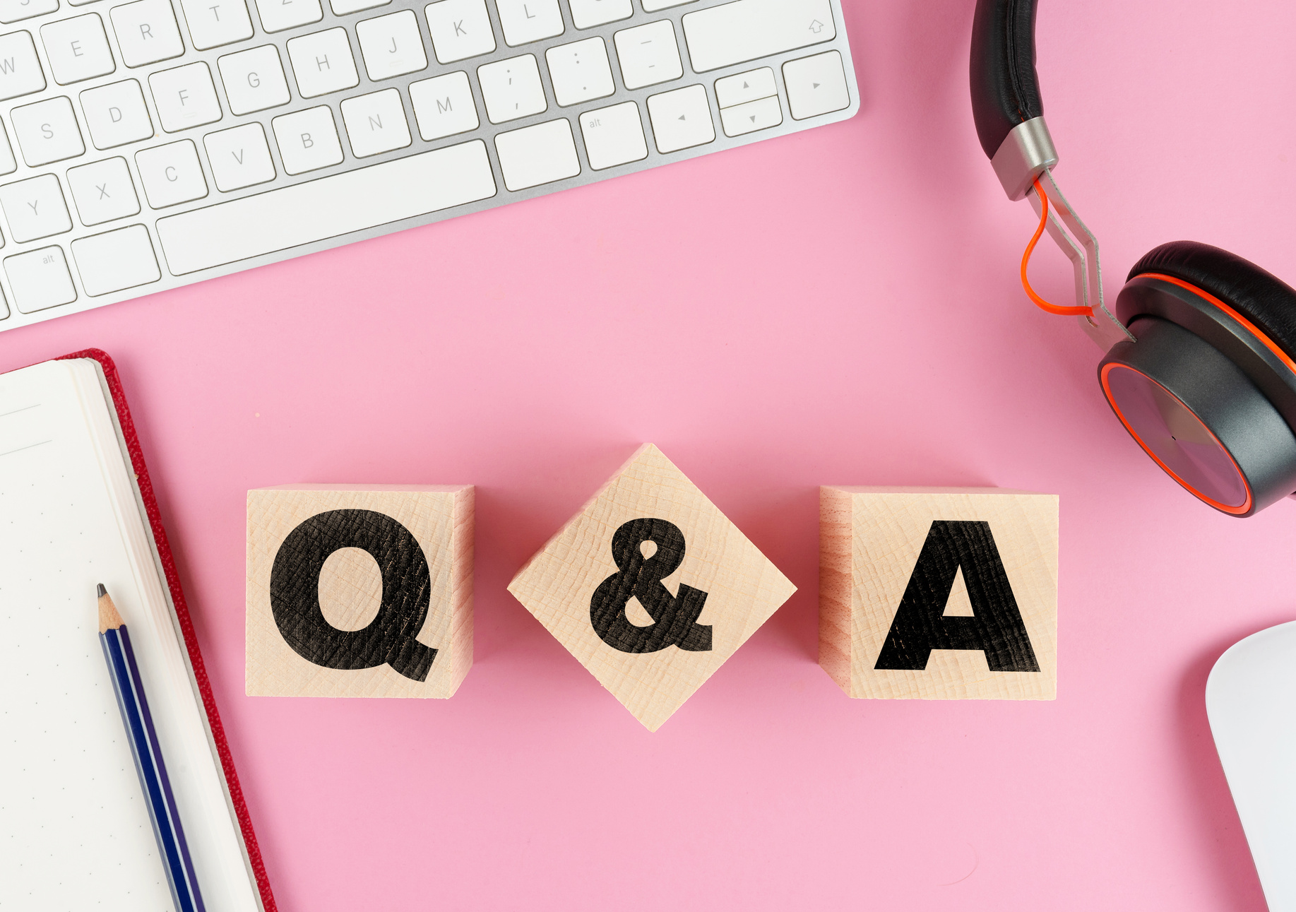 Q and A on Wooden Blocks on Pink Desk